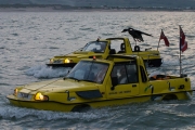 Two Dutton amphibious cars coming into Dover at Night